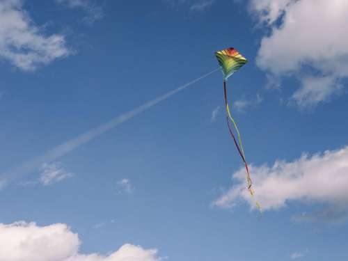 kite play blue sky clouds