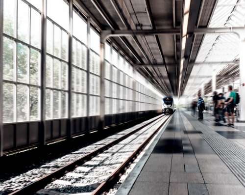 train station black and white railway track