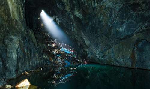 rocks water cave flashlight adventure