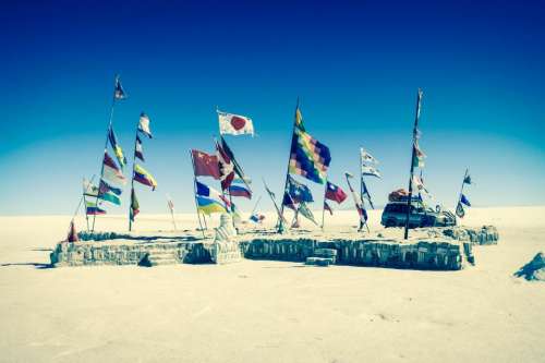 Uyuni Salt Flats Bolivia flags suv truck