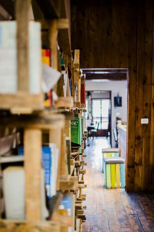 library shelves books wood panels