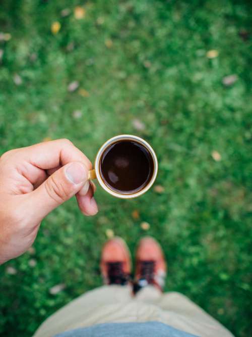 espresso coffee hands grass outside