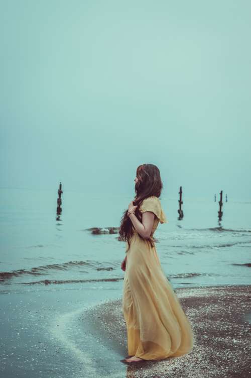 sad woman beach dress ocean