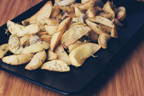 potatoes wedges rosemary food lunch