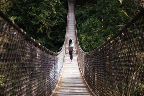 woman bridge hiking walking forest