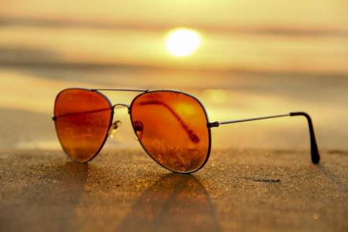 sunglasses sand beach sky sunlight