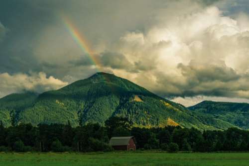 rainbow mountains hills green grass