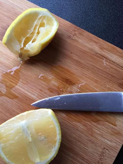 lemons fruits knife cutting board kitchen