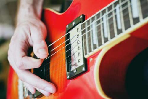 guitar pick strings hands musician