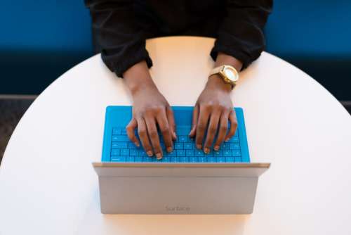 woman business laptop typing surface