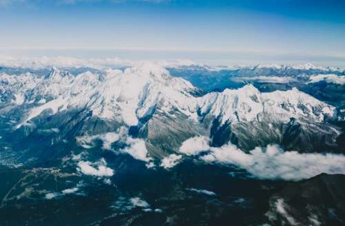 mountains peaks summit snow cliffs