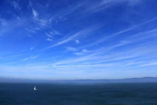 blue sky clouds sailboat ocean