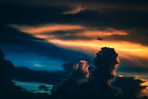sunset dusk sky clouds airplane