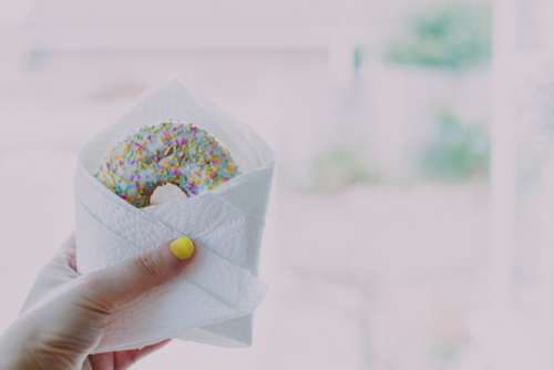 donut sprinkles hand yellow nails