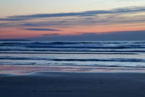 ocean beach dawn sunrise clouds