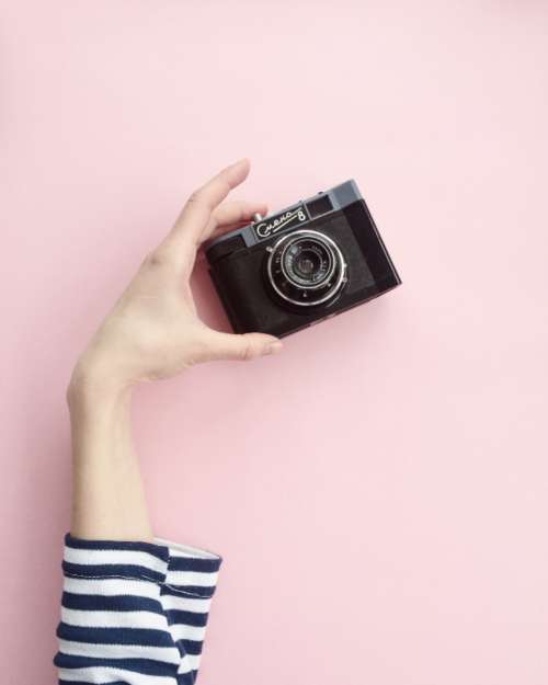 girl camera pink background minimal techology