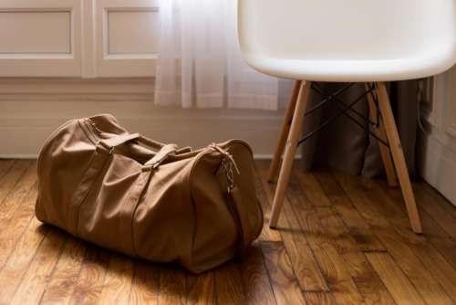 luggage duffle bag bag hardwood floors
