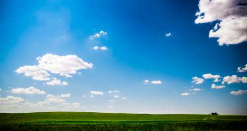 sunny landscape green grass grass blue sky