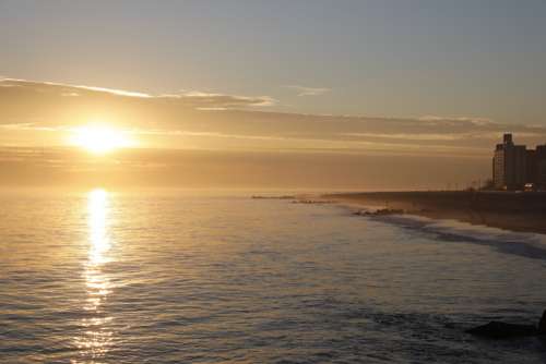 sunset water beach coast ocean