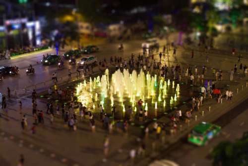 fountain park water lights blur