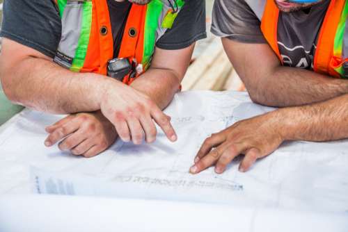 construction blueprint planning hands people