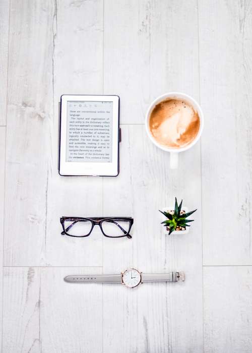 reader coffee glasses plant watch