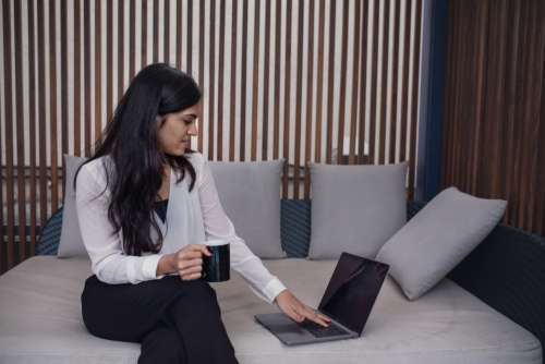 woman laptop sitting coffee working