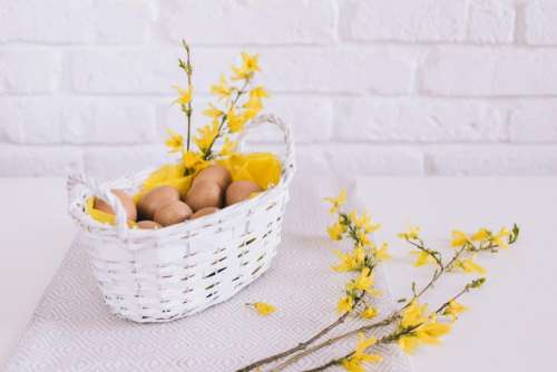 white wall basket yellow flowers
