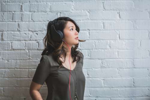 woman listening music headphones sound