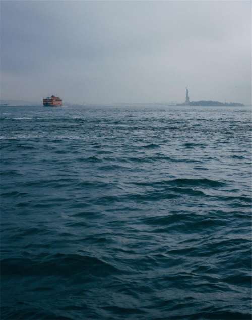 statue of liberty liberty island water boats New York