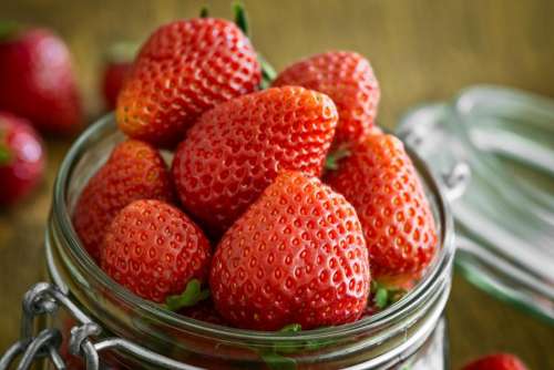 red fruit strawberry glass jar