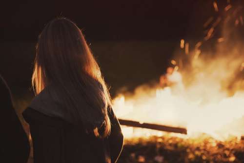 girl woman long hair blonde bonfire