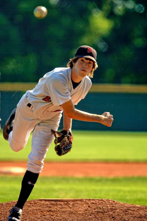 people man guy playing baseball