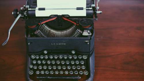 typewriter keyboard paper letters work