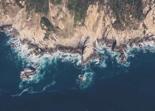 mountains cliffs rocks coast ocean