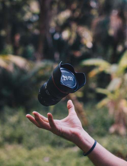 camera lens black hand palm