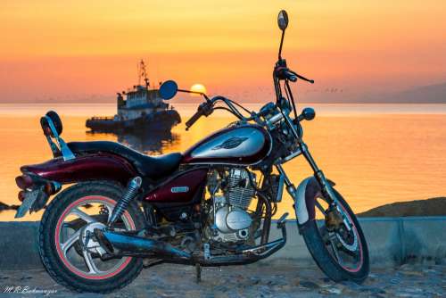 motorbike sunset view sea water