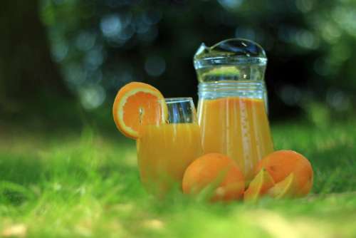 orange juice oranges glass jug