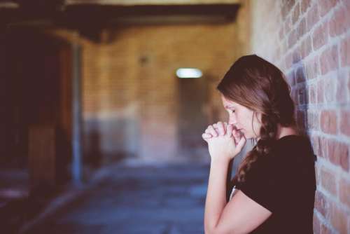 people girl alone praying wall