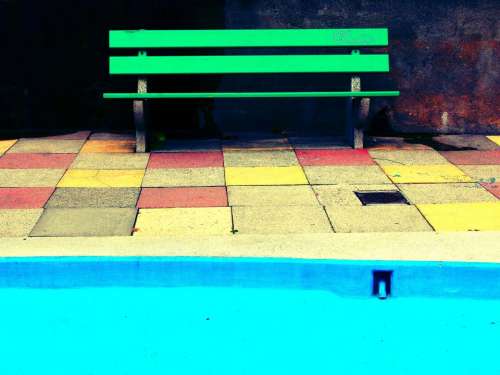 green bench blue pool tiles