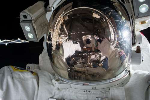 astronaut helmet white space dark