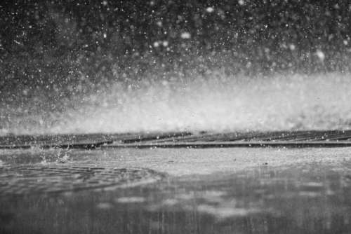 raining rain drops wet black and white water