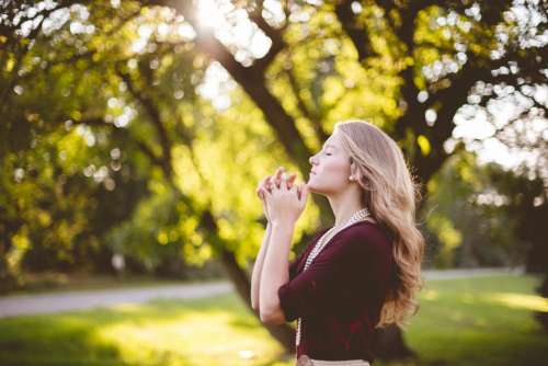people girl praying nature green