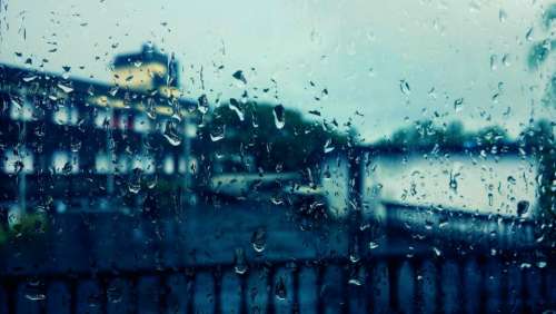 window raindrops water view buildings