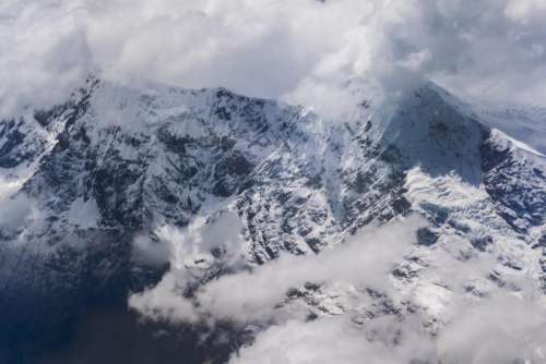 mountains peaks summit clouds nature