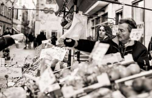 people man woman market black and white