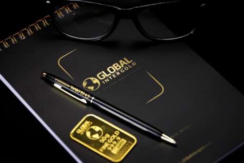 notebook black pen eyeglasses gold