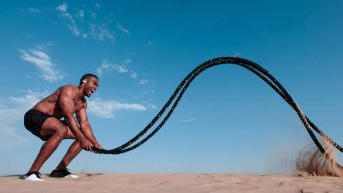 man workout rope strength power