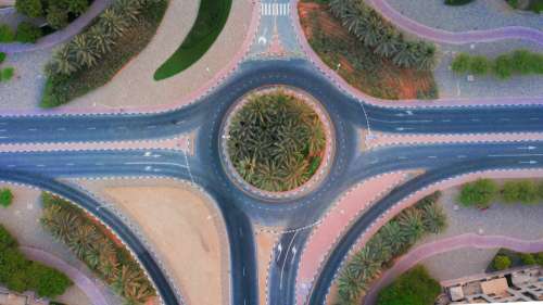 drone road desert roundabout palm tree