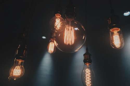 light bulb electricity blur dark